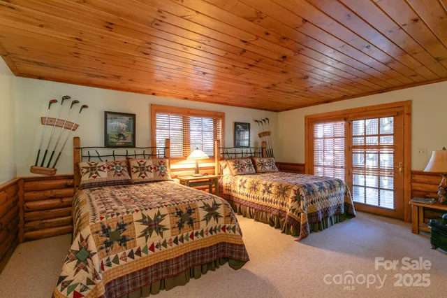 a bathroom with a double vanity sink mirror and a bathtub