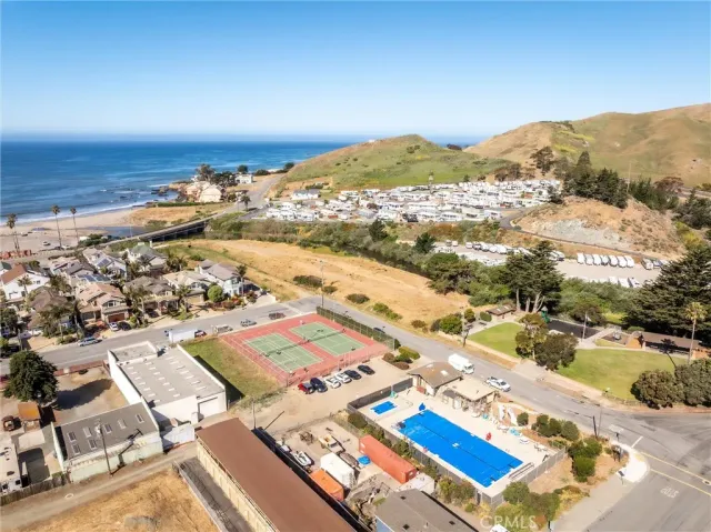 an aerial view of residential houses with outdoor space
