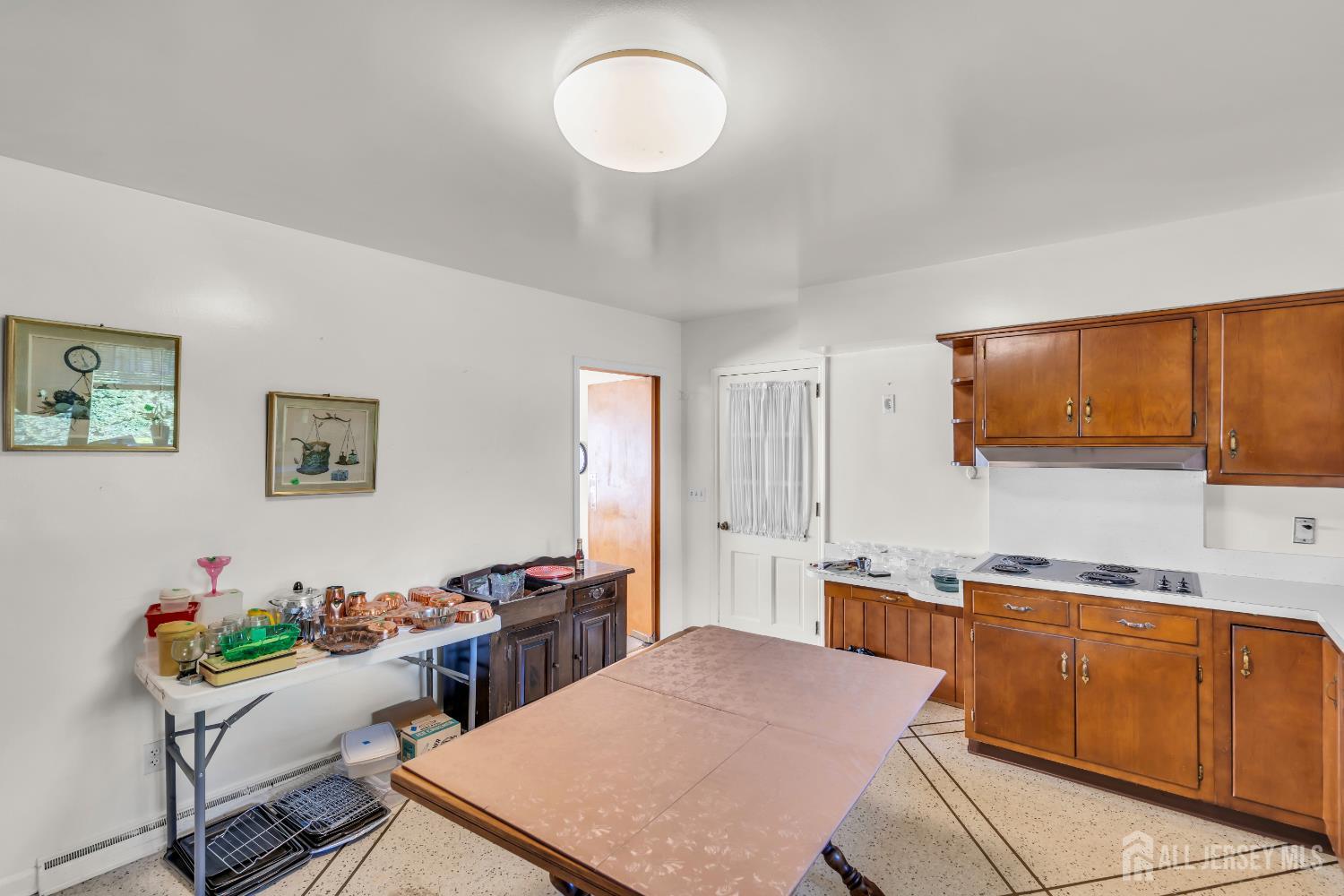 16 Stafford Road Colonia, NJ 07067 - Photo 12 of 41 a kitchen with a table and chairs in it