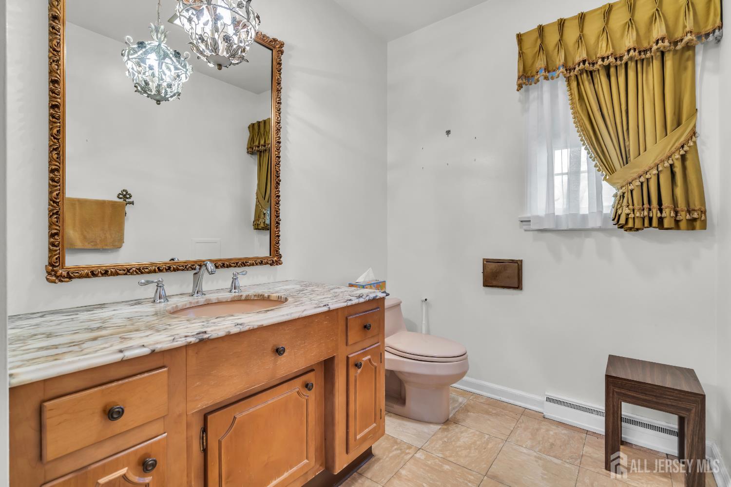 16 Stafford Road Colonia, NJ 07067 - Photo 16 of 41 a bathroom with a granite countertop toilet sink and mirror