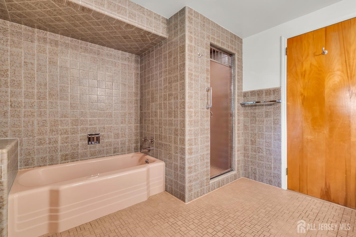 16 Stafford Road Colonia, NJ 07067 - Photo 26 of 41 a bathroom with a bathtub and shower