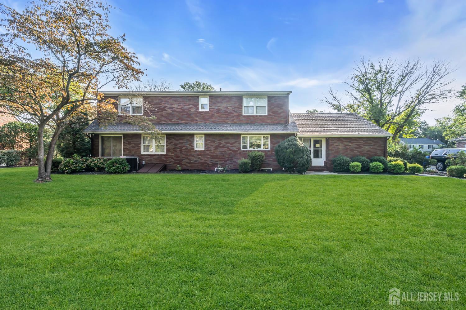 16 Stafford Road Colonia, NJ 07067 - Photo 32 of 41 a front view of house with yard and green space