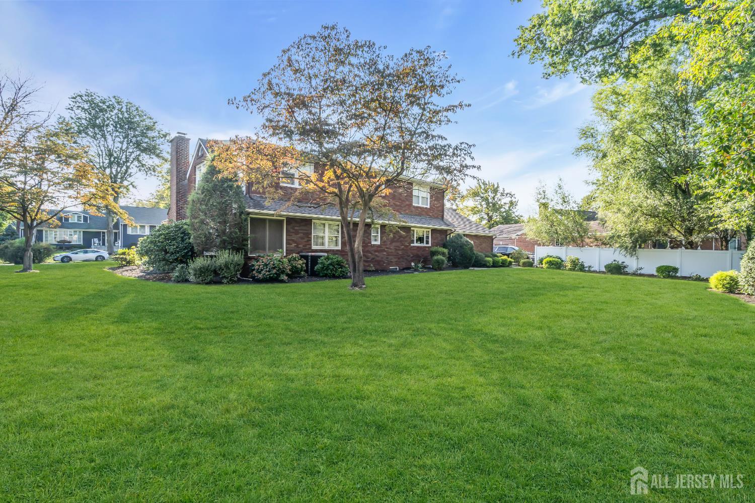 16 Stafford Road Colonia, NJ 07067 - Photo 33 of 41 a view of a house with a big yard and large trees