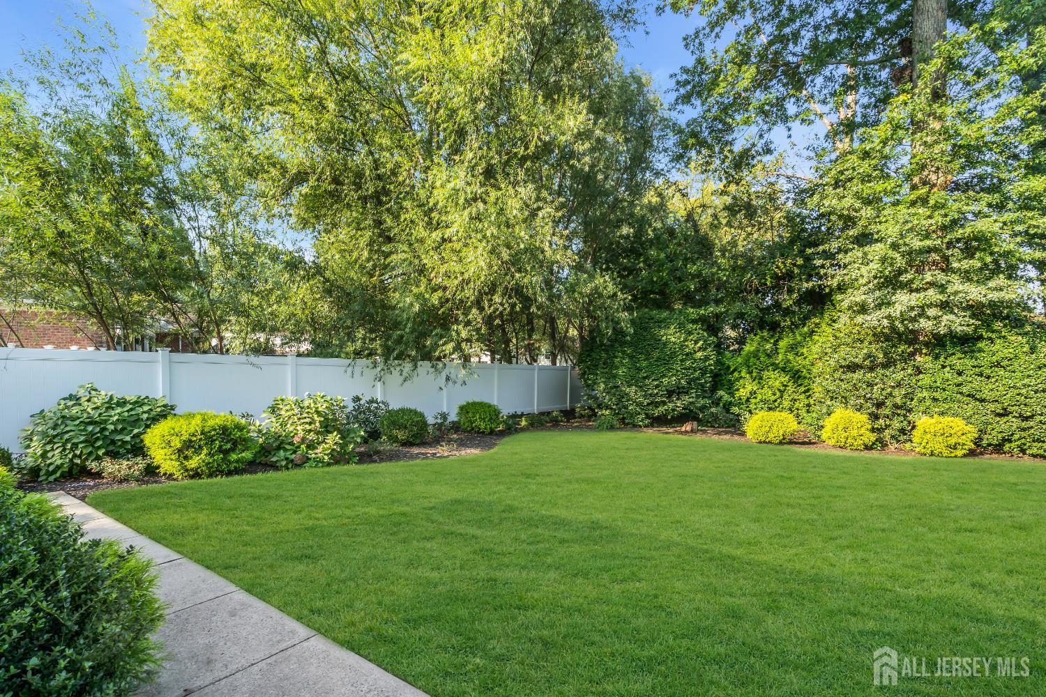 16 Stafford Road Colonia, NJ 07067 - Photo 35 of 41 a view of a garden with a bench in the background