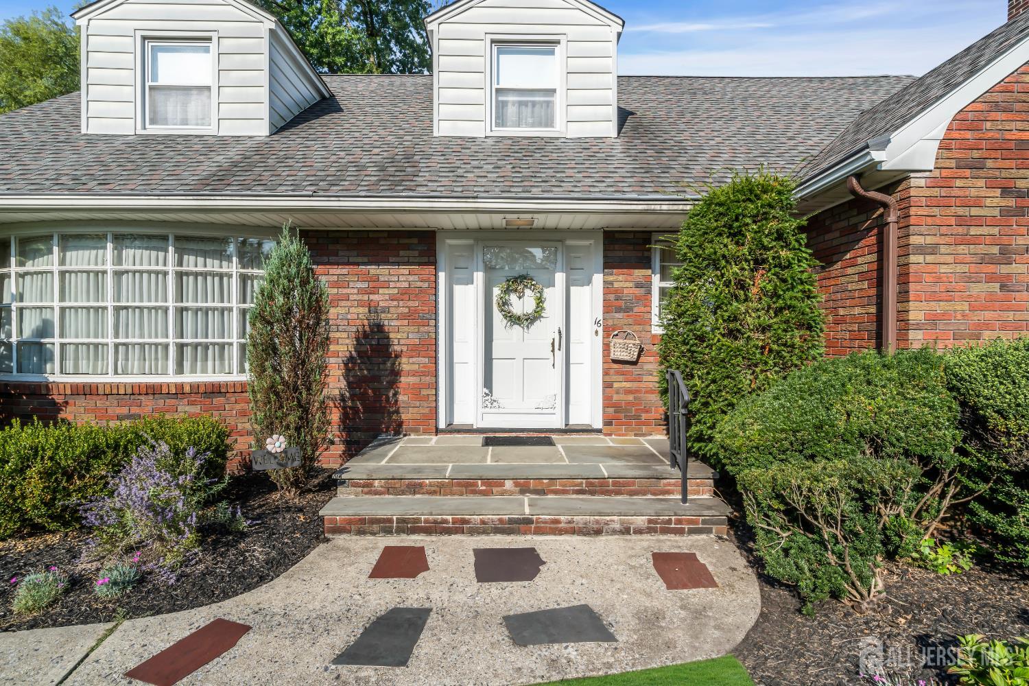 16 Stafford Road Colonia, NJ 07067 - Photo 5 of 41 a front view of a house with a yard