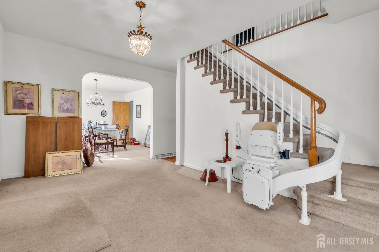 16 Stafford Road Colonia, NJ 07067 - Photo 9 of 41 a view of livingroom with furniture and staircase