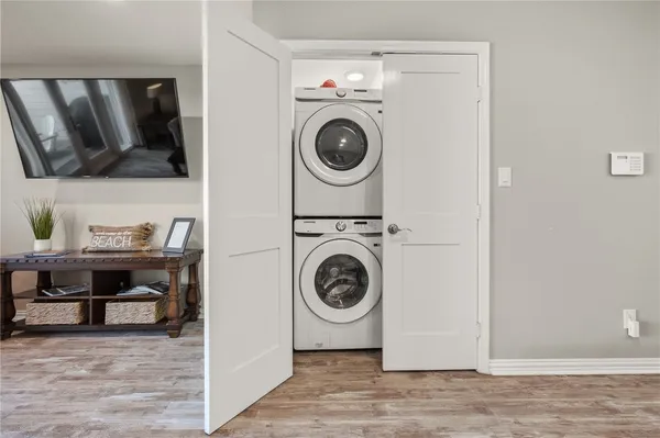 a view of storage and utility room with washer and dryer