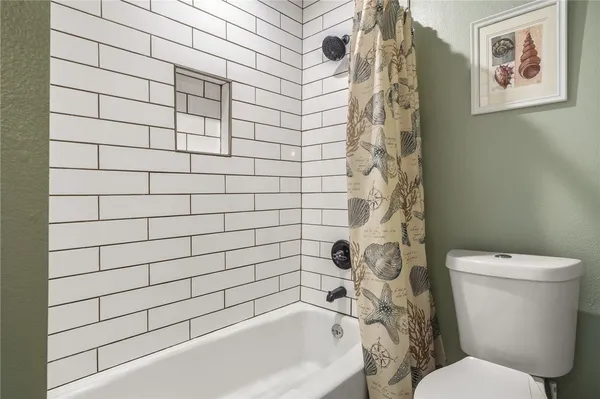 a view of a house with swimming pool and sitting area