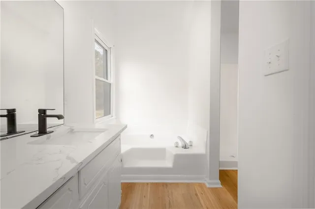 a bathroom with a sink and a bathtub