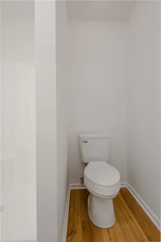 a white toilet sitting in a bathroom