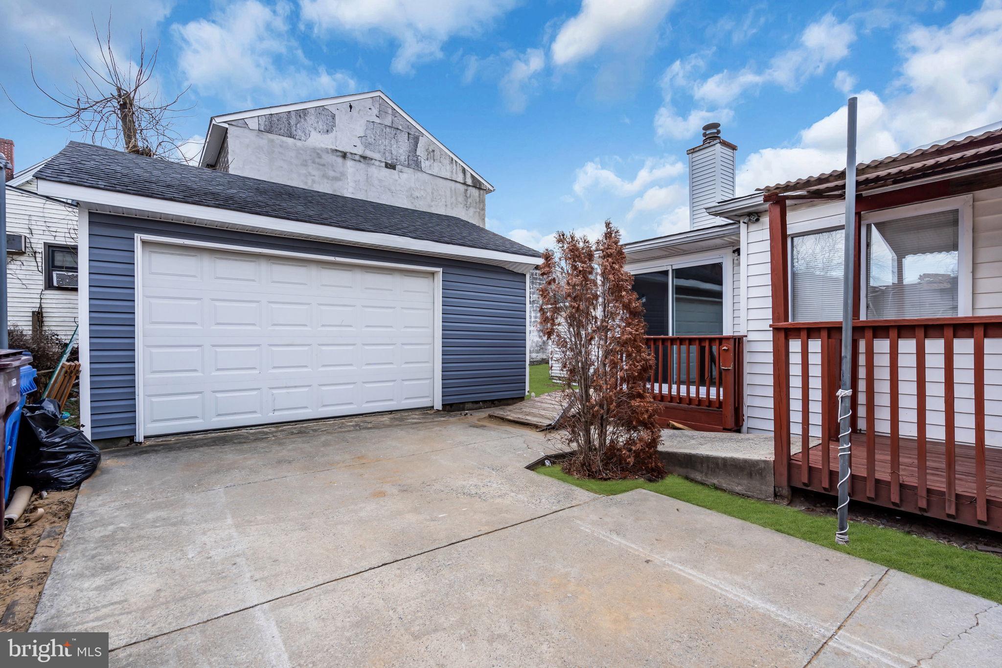 210 Kossuth Street, Unit B Riverside, NJ 08075 - Photo 6 of 10 a view of a house with a small yard and wooden fence