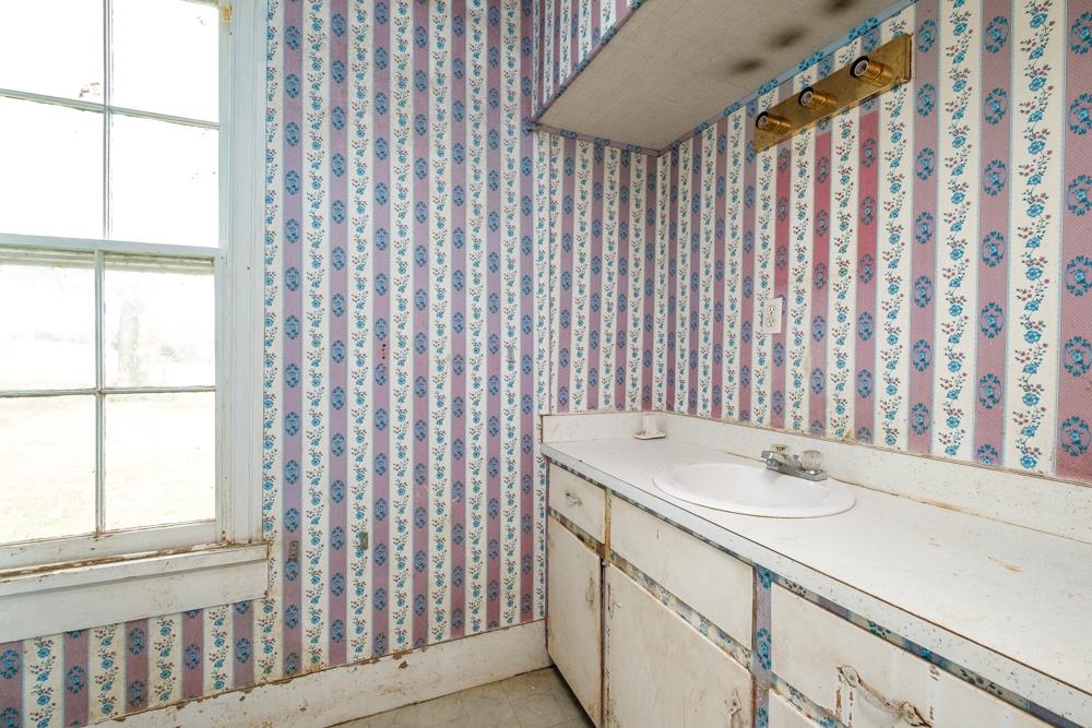 8724 Leroy Road Grottoes, VA 24441 - Photo 23 of 31 a bathroom with a sink and a mirror