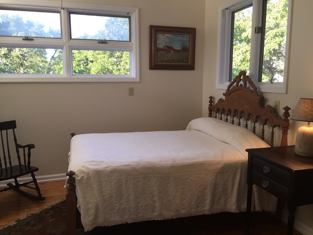 205 West School Road Maroa, IL 61756 - Photo 20 of 20 a bedroom with a bed and wooden floor