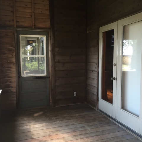 205 West School Road Maroa, IL 61756 - Photo 4 of 20 an empty room with wooden floor and windows