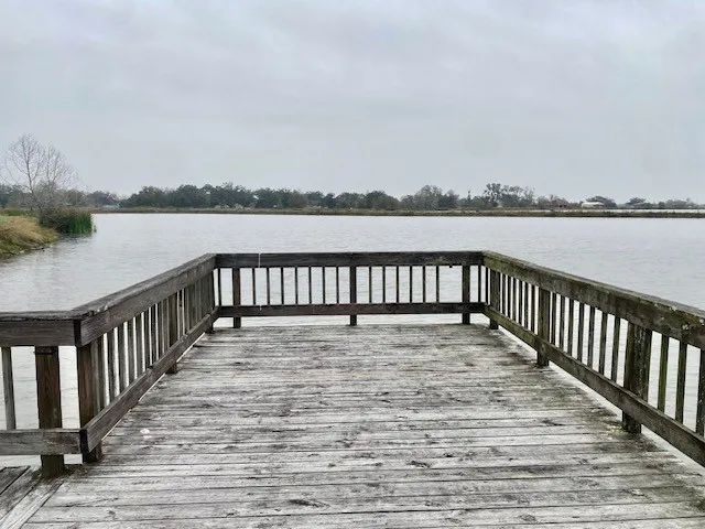a swimming pool with wooden fence