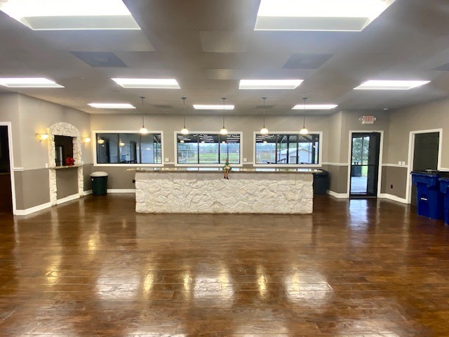 218 Cattle Drive Trail Angleton, TX 77515 - Photo 23 of 34 a view of a kitchen with granite countertop a large counter top and a stove