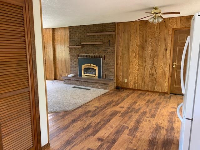 570 Southwest 2nd Court Cedaredge, CO 81413 - Photo 6 of 32 an empty room with wooden floor fireplace and windows