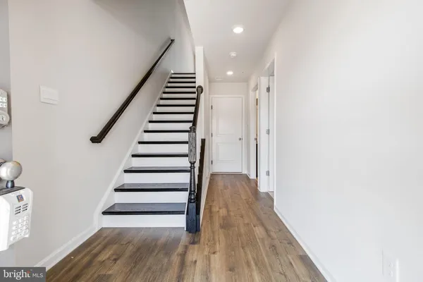 a view of entryway with wooden floor