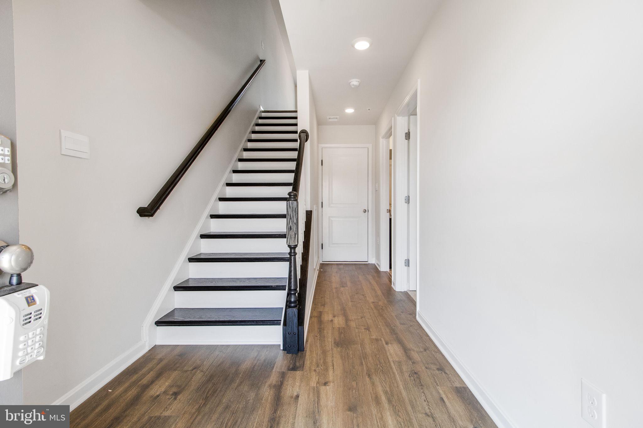 280 Ensemble Way Frederick, MD 21701 - Photo 23 of 25 a view of entryway with wooden floor