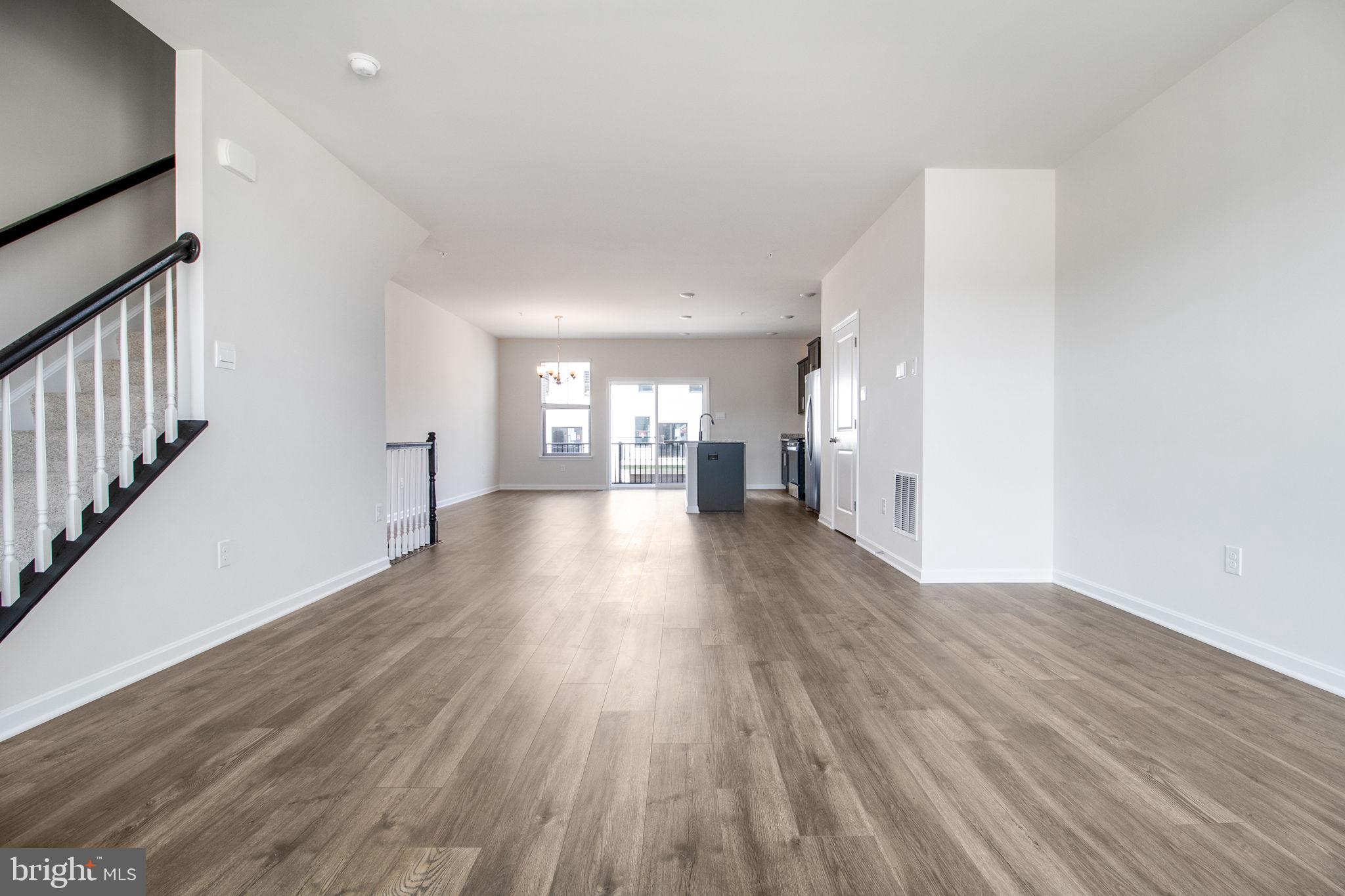 280 Ensemble Way Frederick, MD 21701 - Photo 6 of 25 a view of a big room with wooden floor and windows