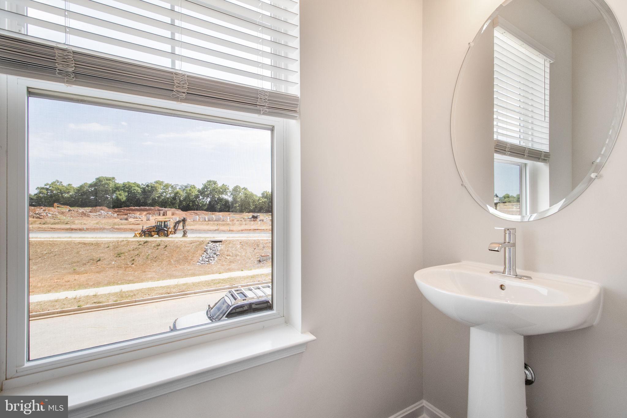 280 Ensemble Way Frederick, MD 21701 - Photo 7 of 25 a bathroom with a sink and a mirror