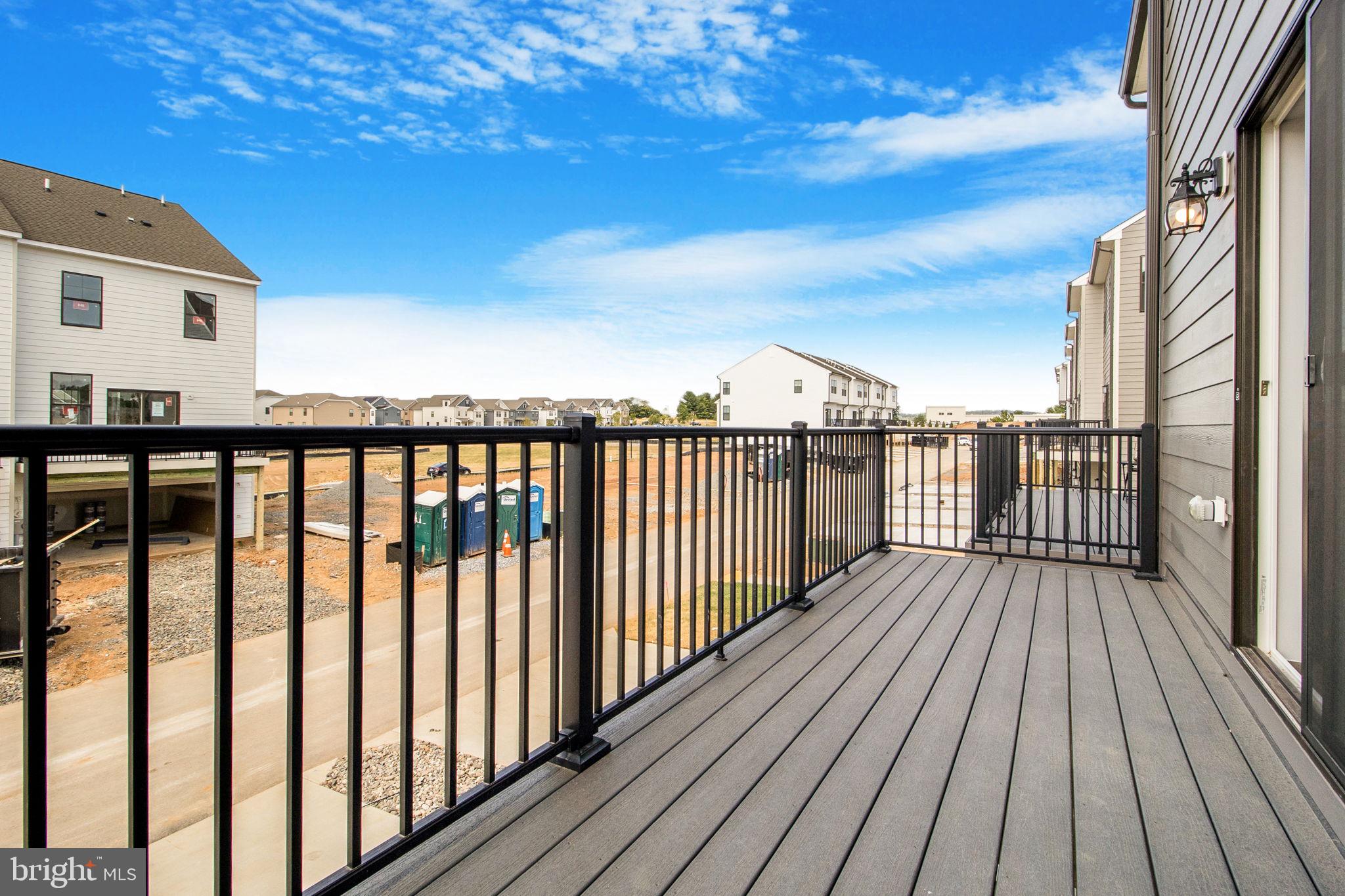 280 Ensemble Way Frederick, MD 21701 - Photo 9 of 25 a view of deck with wooden floor and fence