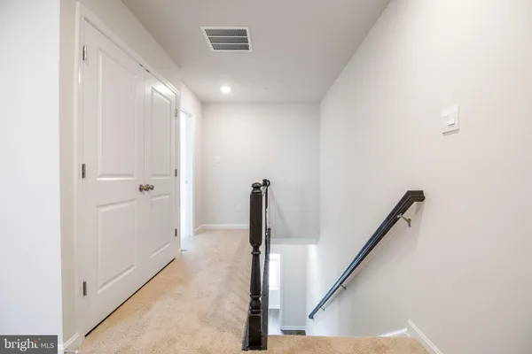 a view of hallway with stairs