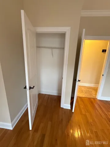 an entryway with wooden floor