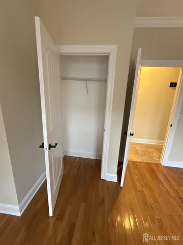 an entryway with wooden floor