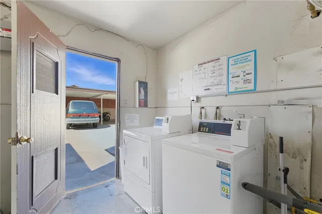 a kitchen that has a refrigerator and a stove