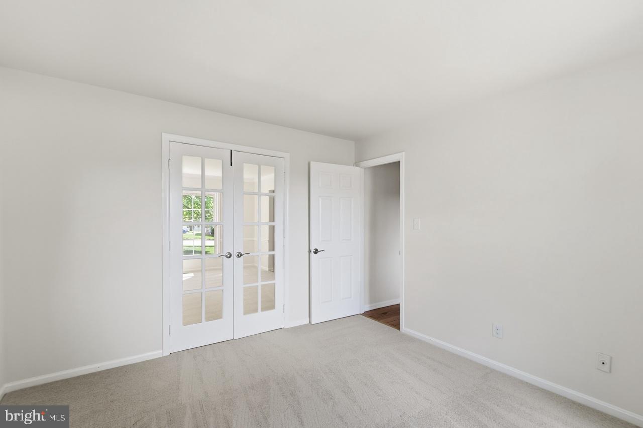 7100 Counter Place Burke, VA 22015 - Photo 23 of 54 Office /library with glass doors to living room