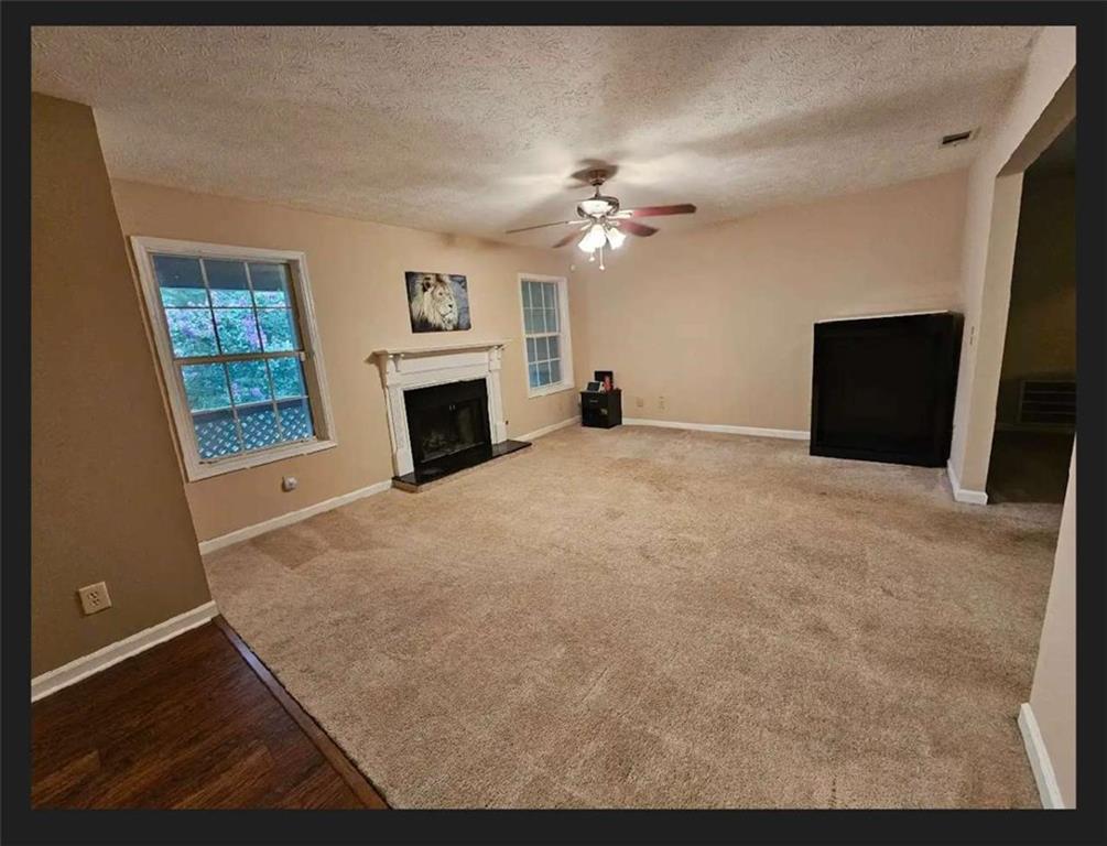 a view of a livingroom with a fireplace