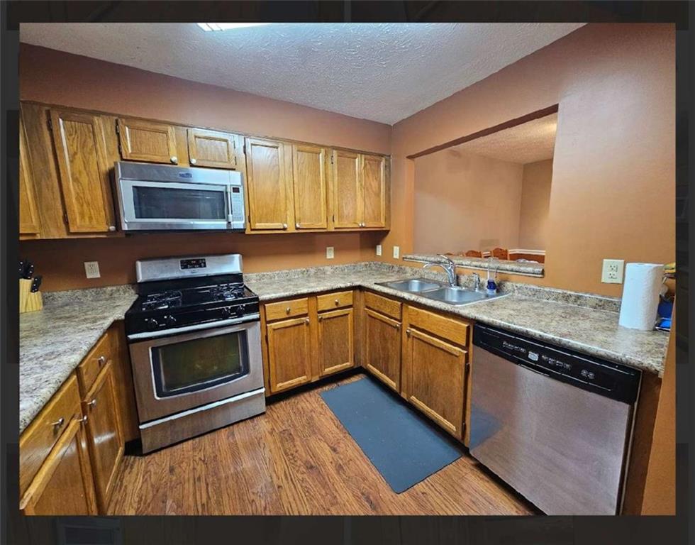 2539 Oakridge Place Decatur, GA 30033 - Photo 11 of 14 a kitchen with granite countertop stainless steel appliances a stove sink and microwave