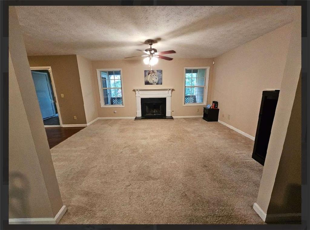 2539 Oakridge Place Decatur, GA 30033 - Photo 3 of 14 a view of an empty room with a fireplace
