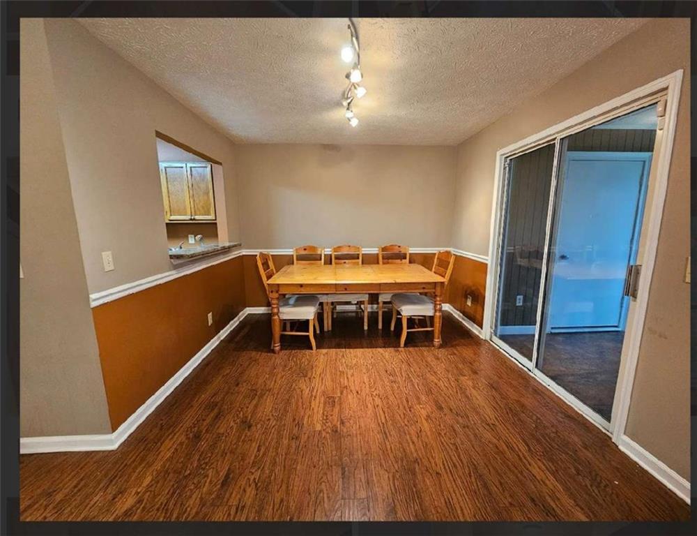 2539 Oakridge Place Decatur, GA 30033 - Photo 6 of 14 a dining room with furniture and wooden floor