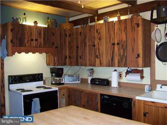 181 Walters Road Bridgeton, NJ 08302 - Photo 4 of 9 a kitchen with a sink and a stove top oven