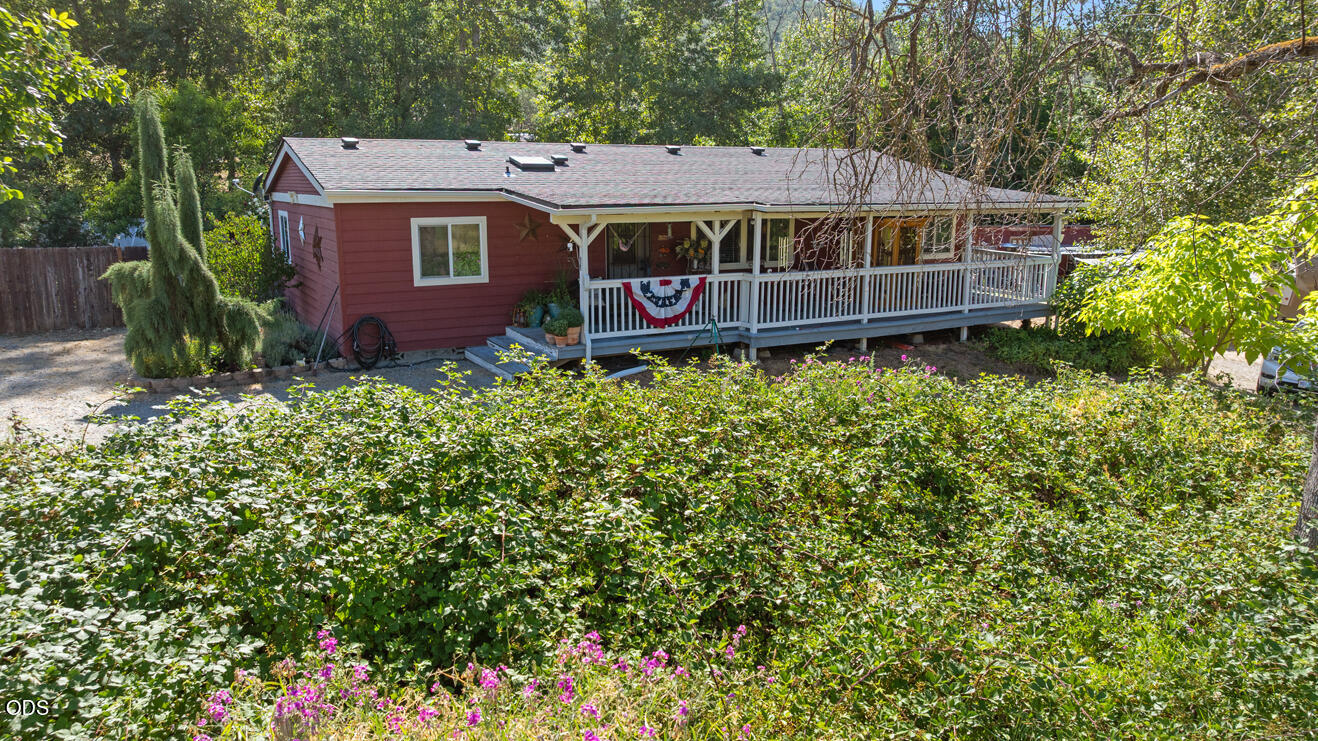 690 Foots Creek Road Gold Hill, OR 97525 - Photo 5 of 45 a view of a chairs in a yard
