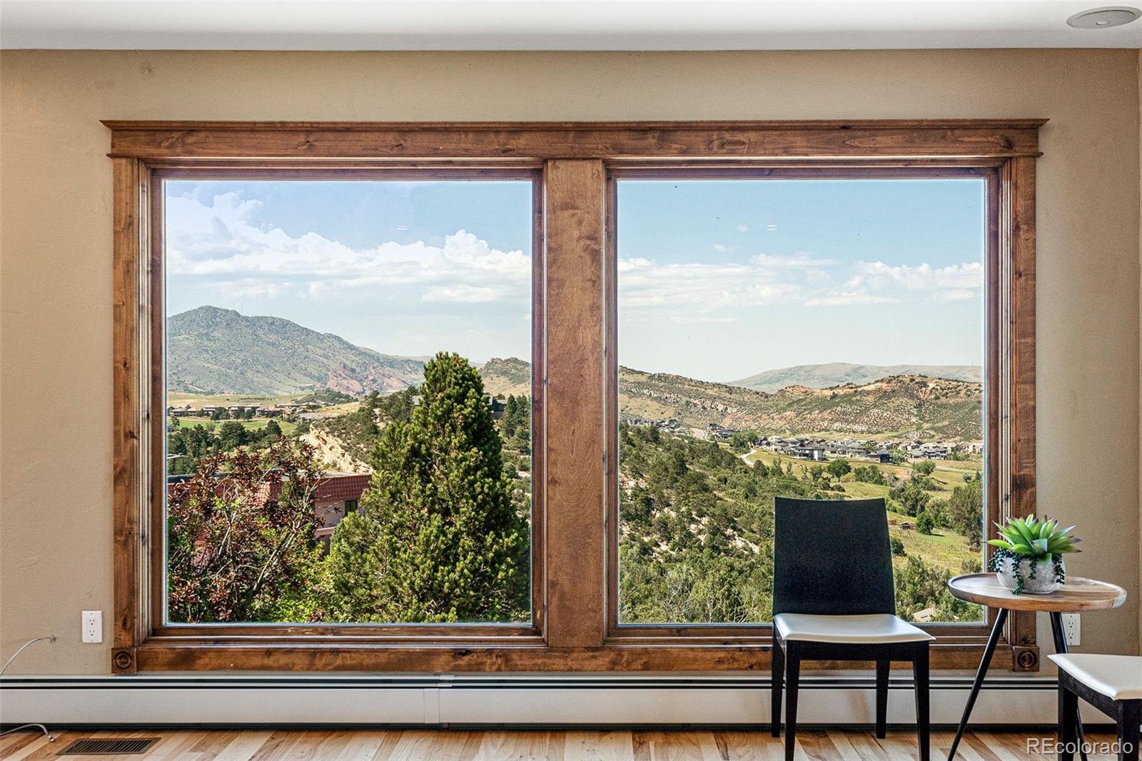 5970 Crestbrook Drive Morrison, CO 80465 - Photo 13 of 34 a view of a room with a large window and table