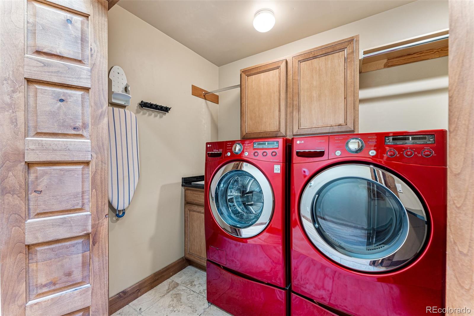 5970 Crestbrook Drive Morrison, CO 80465 - Photo 22 of 34 a view of a storage and utility room with washer and dryer