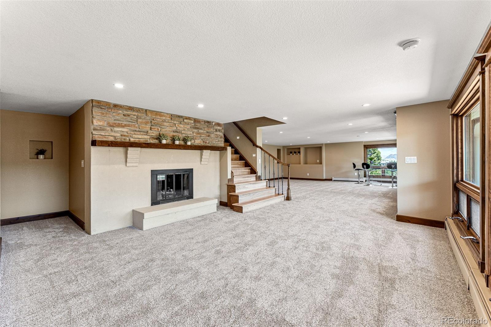 5970 Crestbrook Drive Morrison, CO 80465 - Photo 24 of 34 a view of a livingroom with furniture and a fireplace