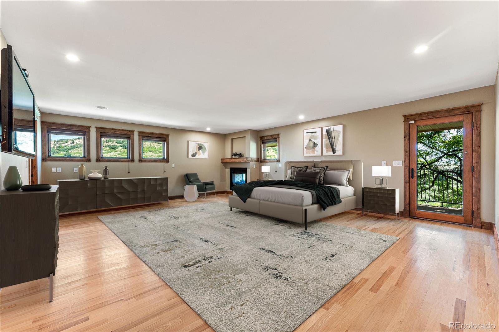 5970 Crestbrook Drive Morrison, CO 80465 - Photo 3 of 34 a living room with furniture and a wooden floor