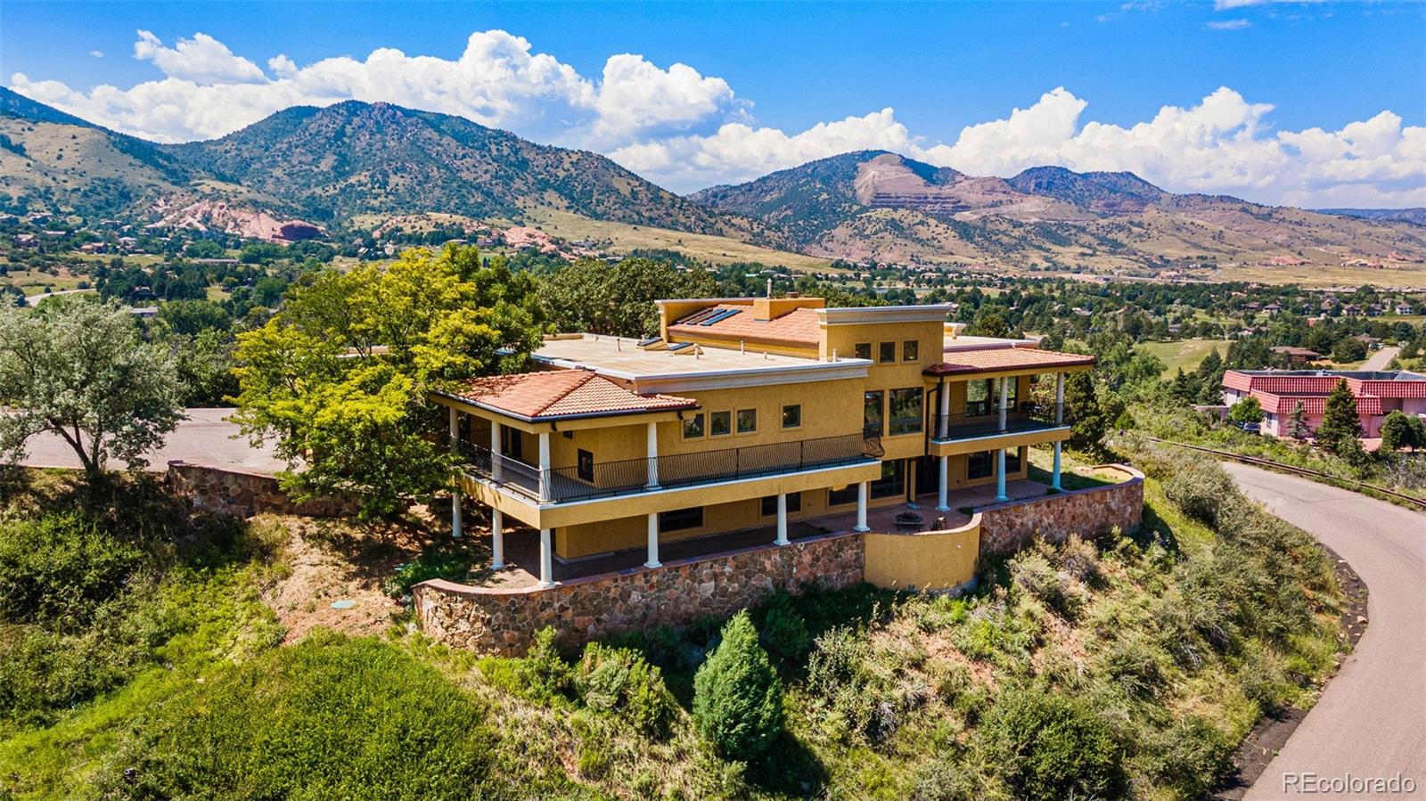 5970 Crestbrook Drive Morrison, CO 80465 - Photo 5 of 34 a view of a large building with a mountain in the background