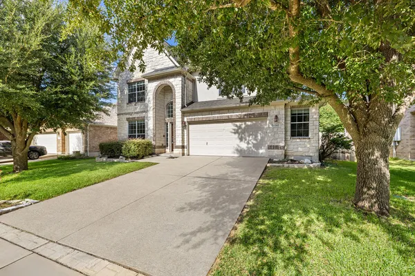 front view of a house with a yard
