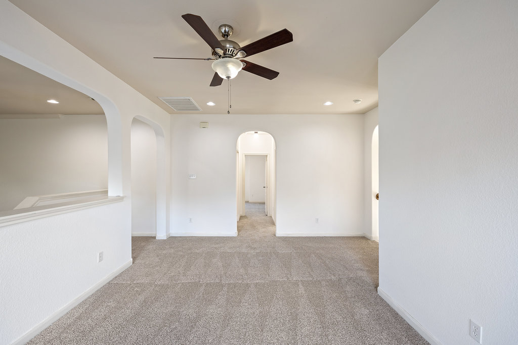 2617 Salorn Way Round Rock, TX 78681 - Photo 13 of 40 wooden floor in an empty room with a window