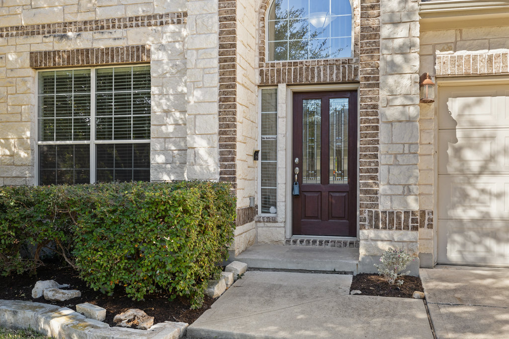 2617 Salorn Way Round Rock, TX 78681 - Photo 2 of 40 a front view of a building with a garden