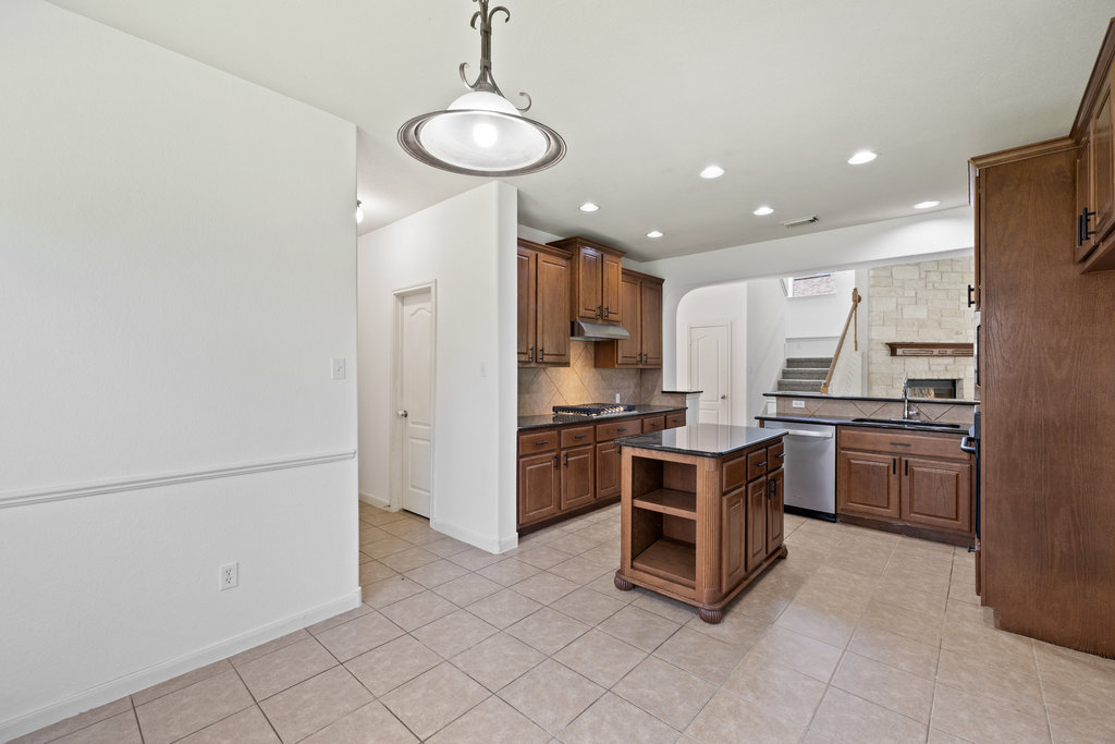 2617 Salorn Way Round Rock, TX 78681 - Photo 22 of 40 a kitchen with a refrigerator and a sink