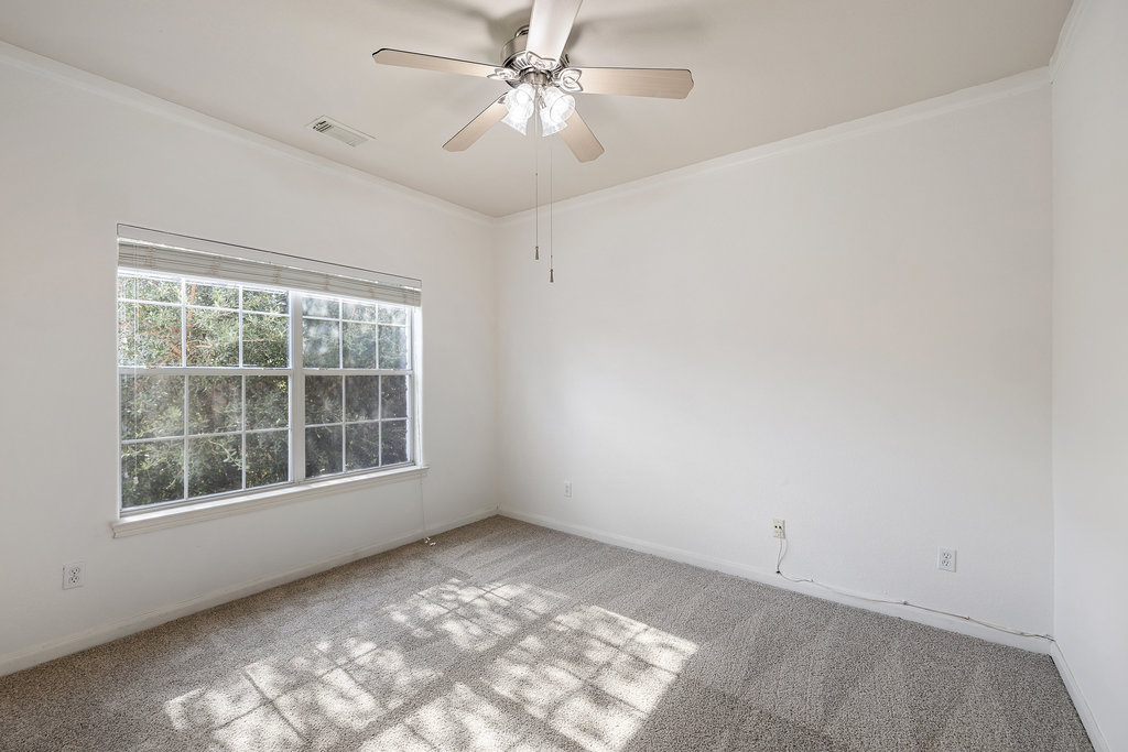 2617 Salorn Way Round Rock, TX 78681 - Photo 29 of 40 an empty room with a window and a fan