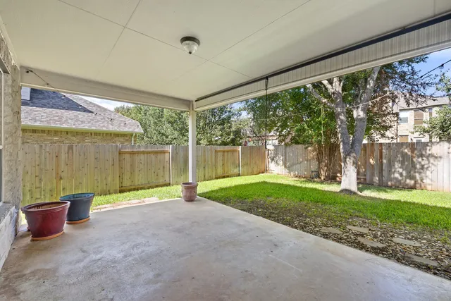 a view of a porch with plants and garden