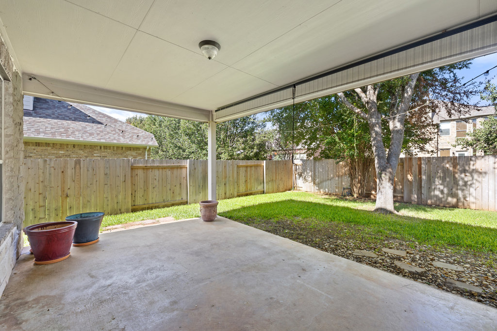 2617 Salorn Way Round Rock, TX 78681 - Photo 36 of 40 a view of a porch with plants and garden