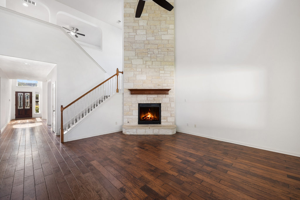 2617 Salorn Way Round Rock, TX 78681 - Photo 5 of 40 a view of an empty room with wooden floor and a window